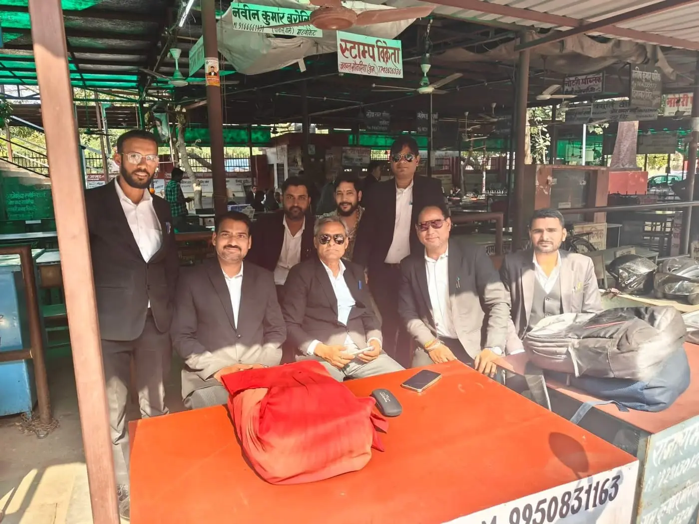 Manoj Kumar Ajmera seated with fellow advocates at the court chambers in Jaipur