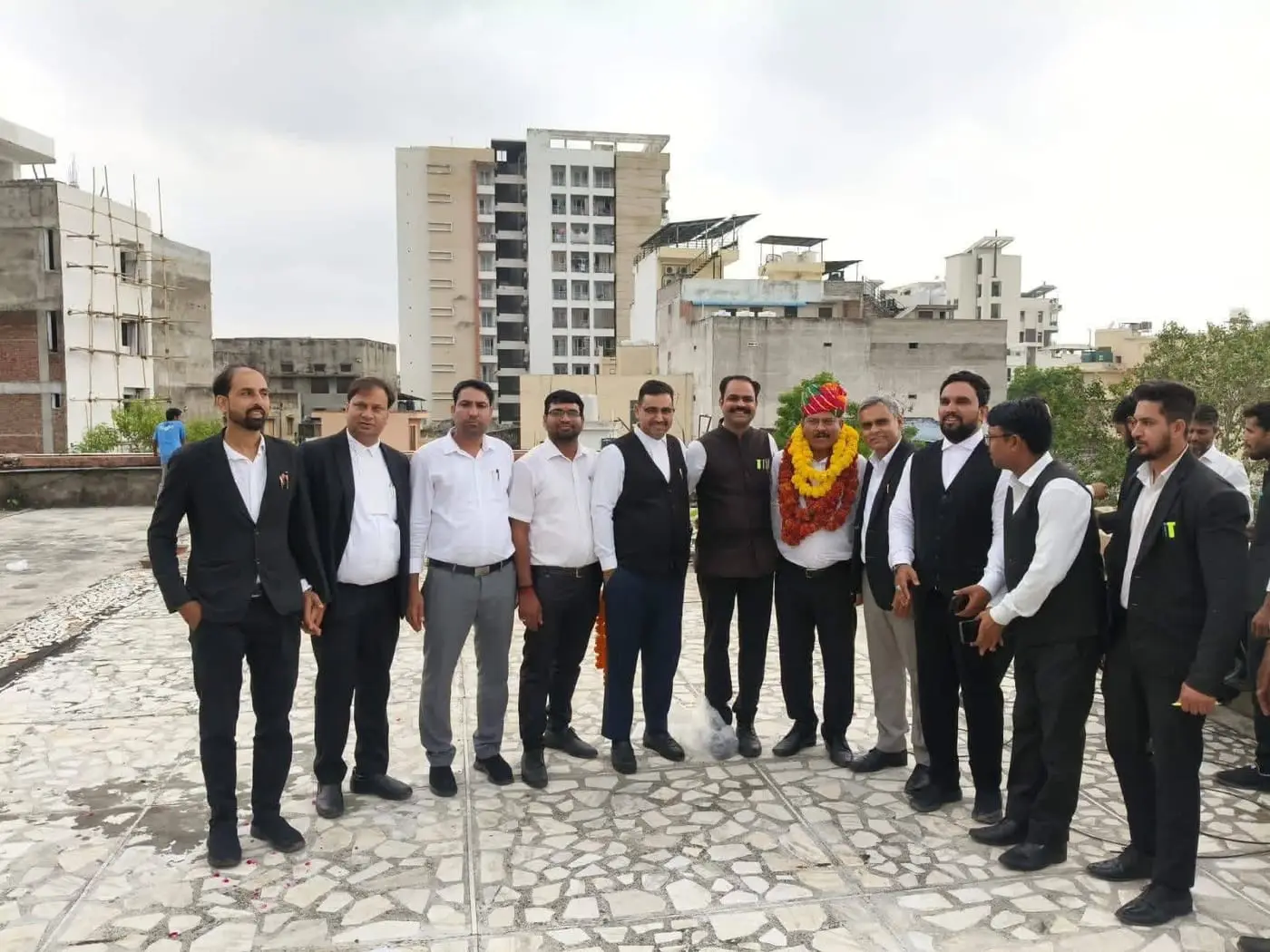 Manoj Kumar Ajmera with a large group of advocates at a felicitation function