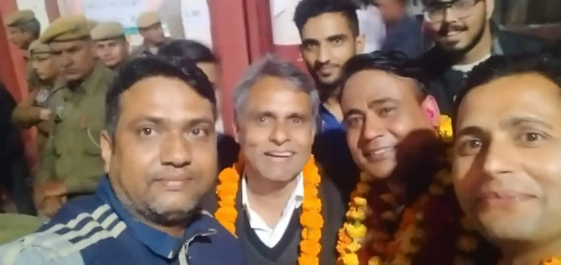 Manoj Kumar Ajmera garlanded and surrounded by supporters after a Bar election result